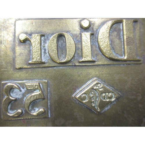 29 - A vintage brass print block marked Dior 750, approx. size 13x8.3cm in good used condition