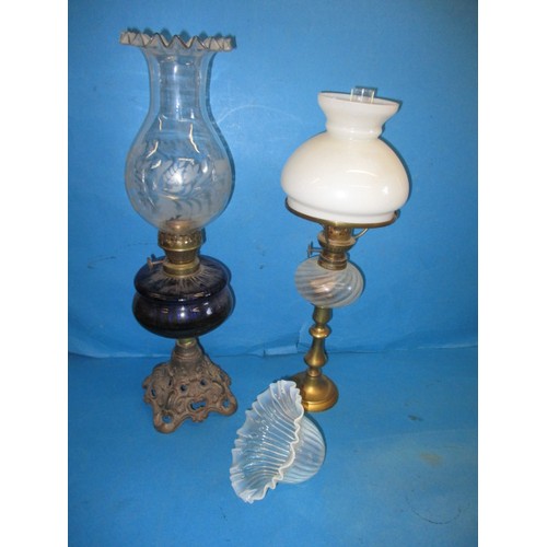 61 - Two early 20th century oil lamps and a Vaseline glass shade, in good used condition with age-related... 