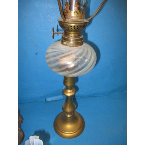 61 - Two early 20th century oil lamps and a Vaseline glass shade, in good used condition with age-related... 