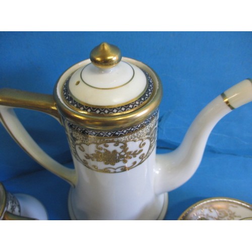 63 - A Noritake coffee set and another antique part set, in used condition with the cream jug and one cup... 