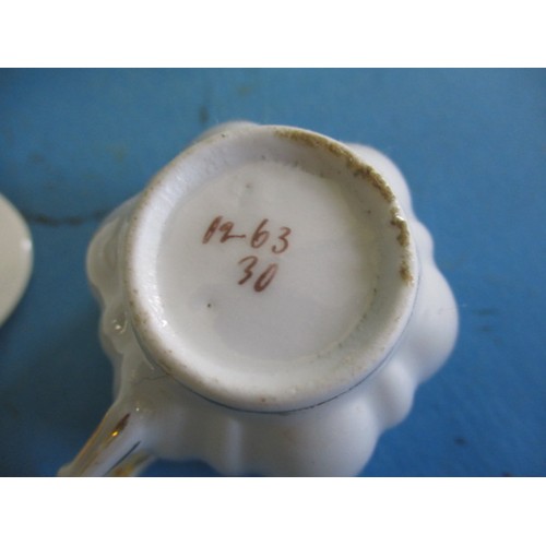 63 - A Noritake coffee set and another antique part set, in used condition with the cream jug and one cup... 