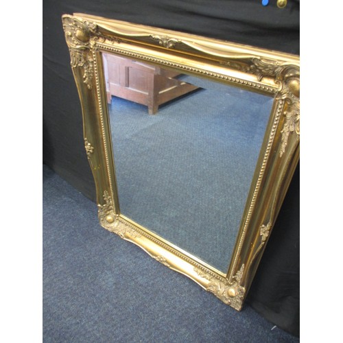 64 - A gilt framed bevelled glass wall mirror, approx. size   75x60cm in good pre-owned condition