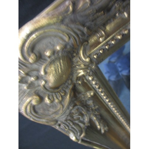 64 - A gilt framed bevelled glass wall mirror, approx. size   75x60cm in good pre-owned condition