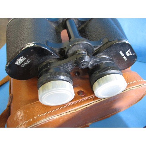 113 - 3 Pairs of binoculars, each in leather case and focus ok, all with use related marks