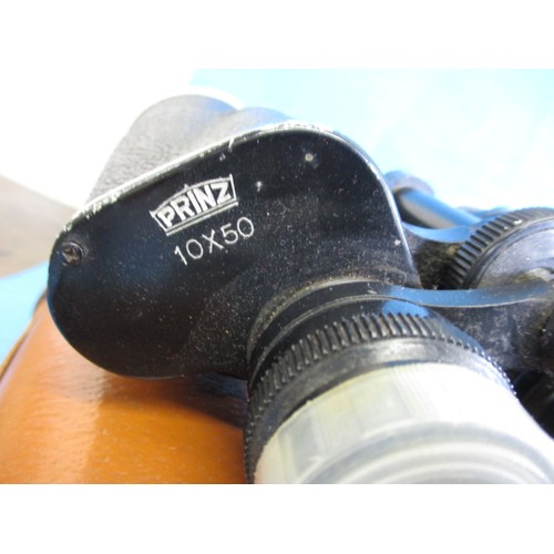 113 - 3 Pairs of binoculars, each in leather case and focus ok, all with use related marks