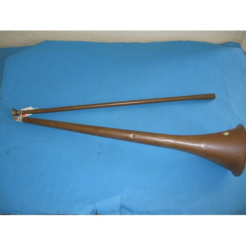 120 - A vintage copper hunting horn, of two part construction, in need of a clean, approx. length 125cm