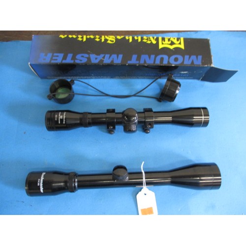 124 - Two telescopic rifle scopes, both in good used condition, one with mounts, covers and box