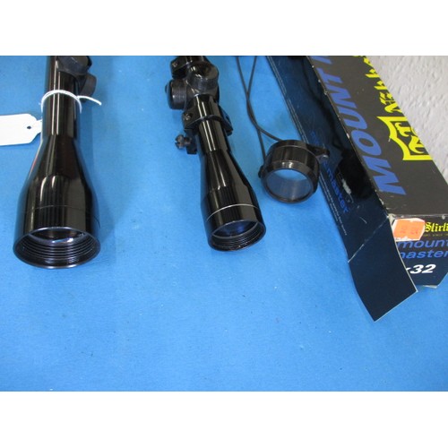 124 - Two telescopic rifle scopes, both in good used condition, one with mounts, covers and box