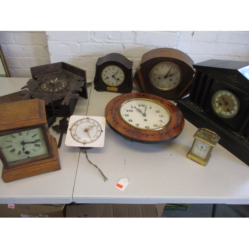 130 - A quantity of vintage clocks to include a black forest example, none tested as to function, all with... 