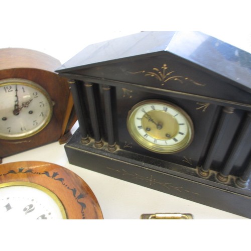 130 - A quantity of vintage clocks to include a black forest example, none tested as to function, all with... 