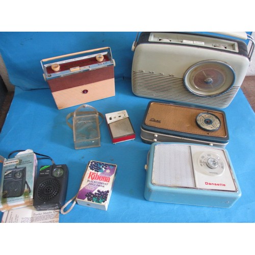 135 - A parcel of vintage portable radios, to include a 1960s  Perdio mini 66 with original clear case