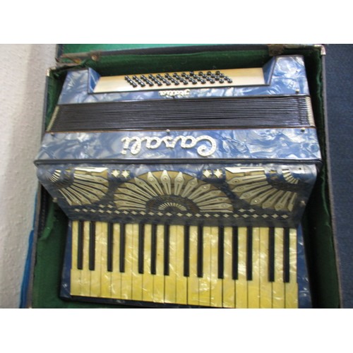 141 - A vintage Cassia Italia piano accordion, in original hard case, not tested as to function and with u... 