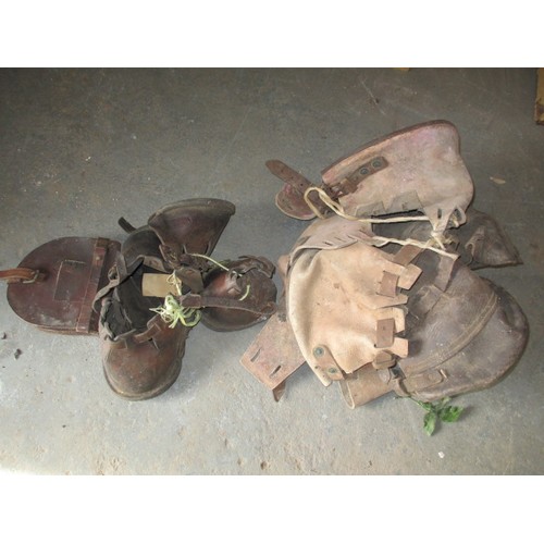 269 - Two sets of antique leather horse shoe lawn protectors, and a spare shoe pouch, in need of a good cl... 