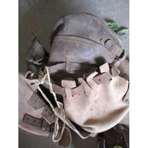 269 - Two sets of antique leather horse shoe lawn protectors, and a spare shoe pouch, in need of a good cl... 