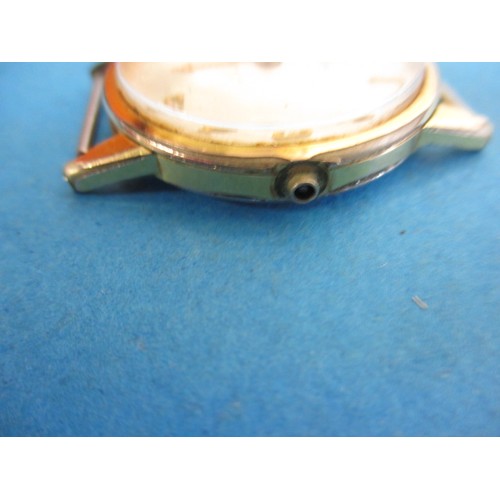 285 - A vintage Omega wrist watch, in used condition with strap or crown and not tested as to function, ap... 