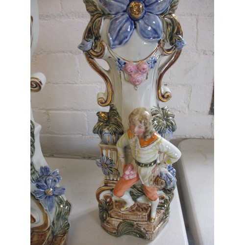 289 - A 19th century German porcelain mantle garniture of 2 vases and a clock stand. Clock not working. In... 