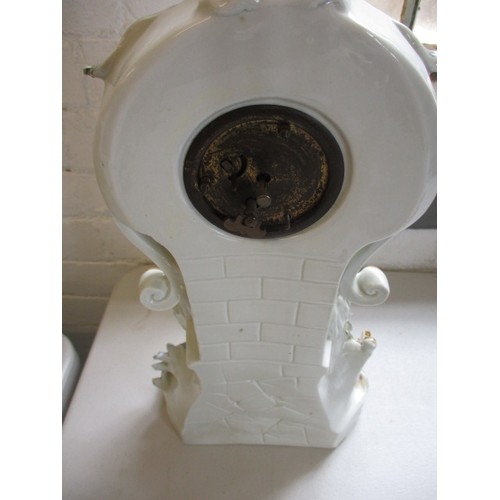 289 - A 19th century German porcelain mantle garniture of 2 vases and a clock stand. Clock not working. In... 