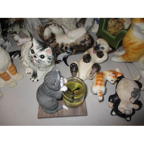 295 - A large quantity of model cat figures, most ceramic, all with no observed damage