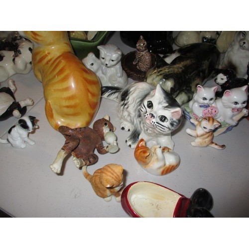 295 - A large quantity of model cat figures, most ceramic, all with no observed damage