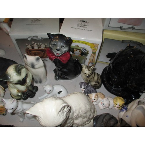 295 - A large quantity of model cat figures, most ceramic, all with no observed damage