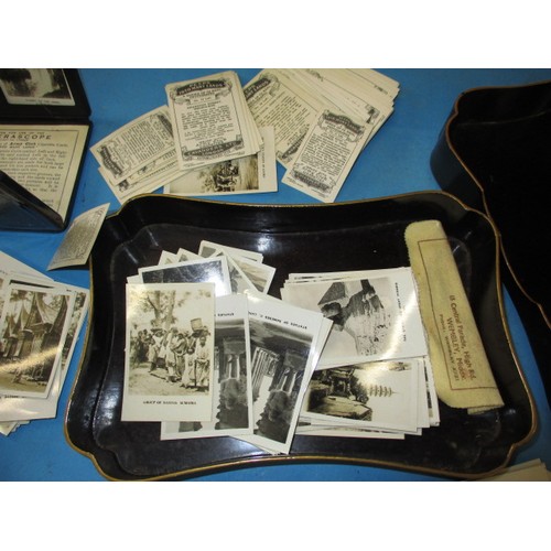 302 - A quantity of vintage Army Club cigarette cards and a Camerascope viewer, all in a vintage paper mâc... 