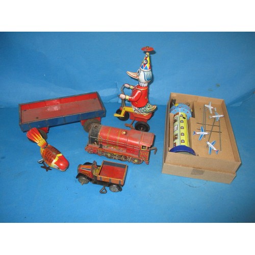 309 - A parcel of vintage tin-plate toys, some clockwork, all in used condition and not tested as to funct... 