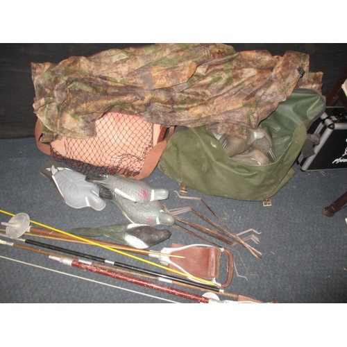 312 - A quantity of pigeon shooting equipment, to include various decoys, kit bags, camo net and cleaning ... 