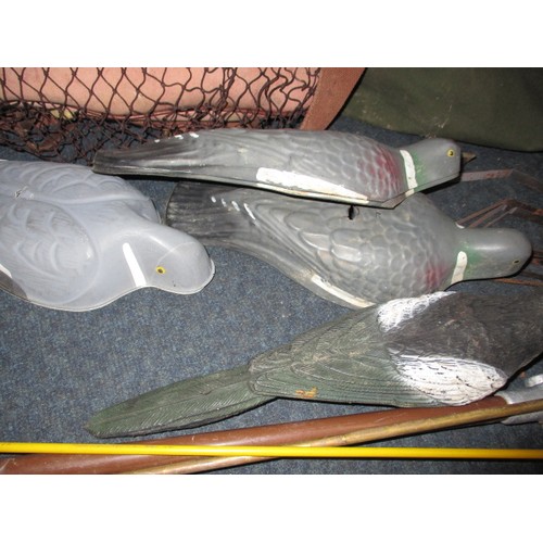 312 - A quantity of pigeon shooting equipment, to include various decoys, kit bags, camo net and cleaning ... 