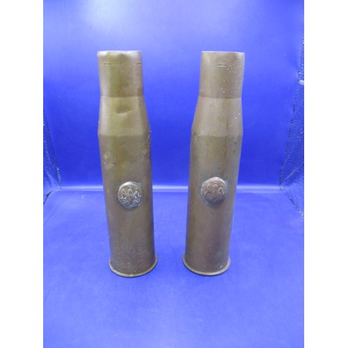 313 - Two WWII brass shell cases, both 37mm and dated 1942 & 1944, each with a tunic button attached, in g... 