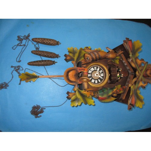 315 - A vintage West German cuckoo clock, with dancing figure carousel and bird, not tested as to function... 