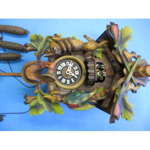 315 - A vintage West German cuckoo clock, with dancing figure carousel and bird, not tested as to function... 