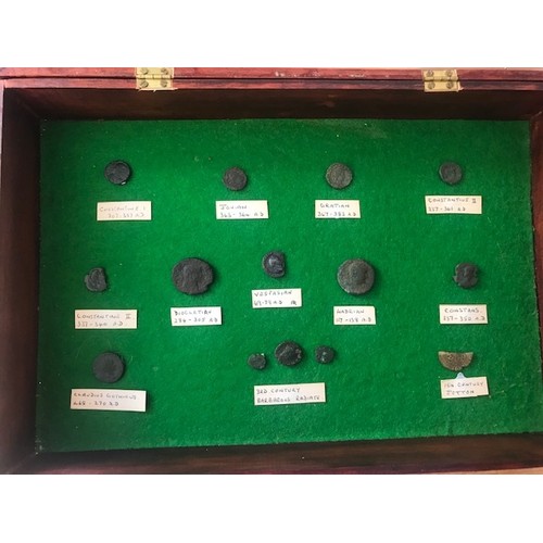 145 - A parcel of roman bronze coins and a George IIII 1821 silver crown, in glazed display cabinet, all c... 