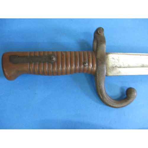 204 - An antique sword bayonet with original metal sheath and leather fitting, approx. length 69cm in good... 