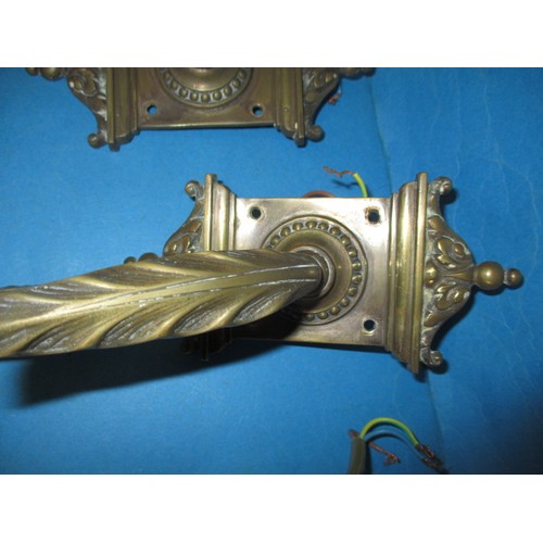 294 - Three vintage brass wall lights, each with glass shade and backing block, in good used condition