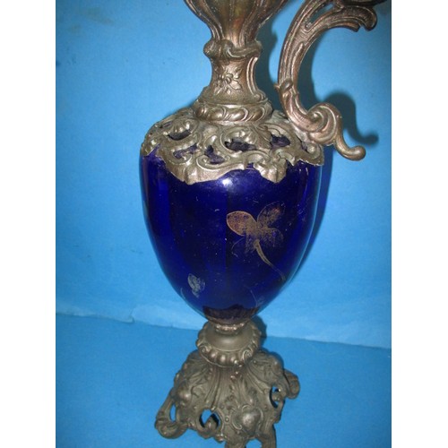 257 - A 19th century metal mounted blue glass ewer ornament, approx. height 49cm, having some loss to gilt... 