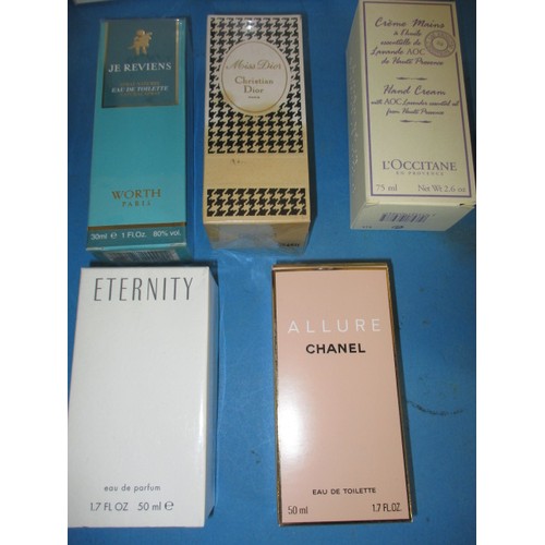 292 - A quantity of un-opened bottles of perfume, to include examples by Chanel.