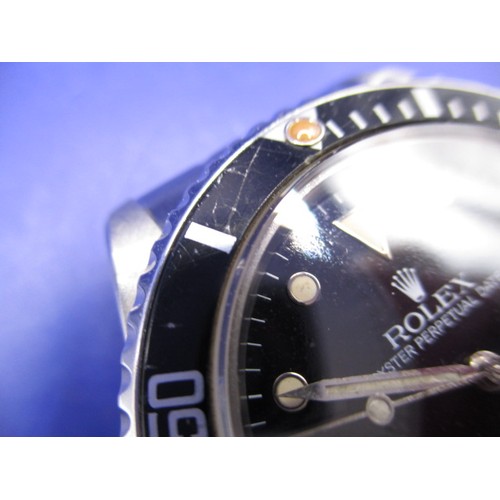 128 - A 1984 Rolex submariner oyster perpetual date, in working order with box and paperwork, a clean watc... 