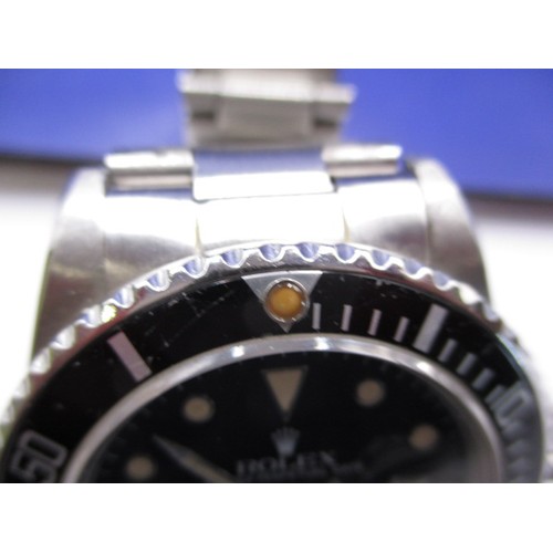 128 - A 1984 Rolex submariner oyster perpetual date, in working order with box and paperwork, a clean watc... 