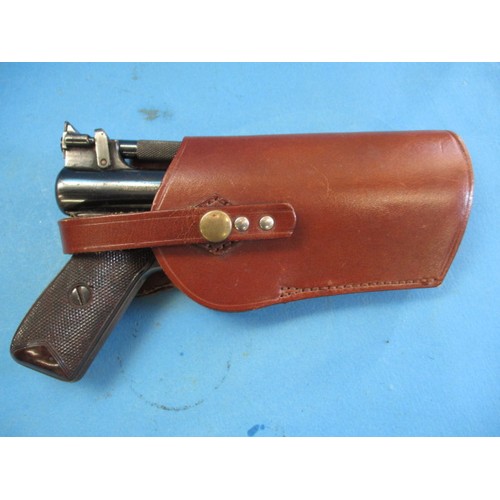 220 - A Webley senior air pistol in leather holster, and a Perfecta starter pistol, in used condition and ... 