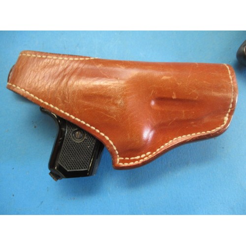 220 - A Webley senior air pistol in leather holster, and a Perfecta starter pistol, in used condition and ... 