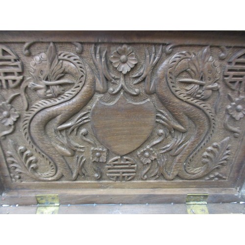 293 - A profusely carved antique Japanese hard wood box, approx. size 31x20x5cm in good used condition