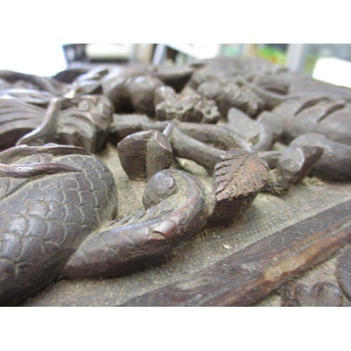 293 - A profusely carved antique Japanese hard wood box, approx. size 31x20x5cm in good used condition