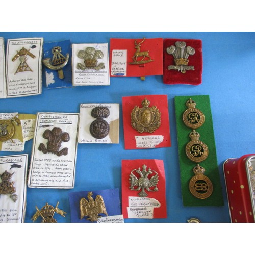 194 - A large quantity of metal military badges, all in good used condition, over 100 in total