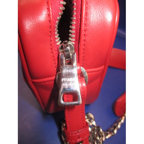 185 - A genuine PRADA chain shoulder crossbody bag, soft calf leather in colour ‘Rosso’, 1BH084. In unused... 