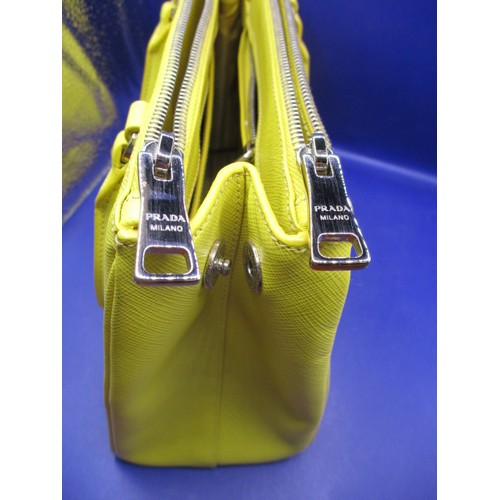 188 - A genuine PRADA small zip tote bag, material ‘Saffiano Lux Leather’, in colour ‘Sole 1’, 1BA863. In ... 