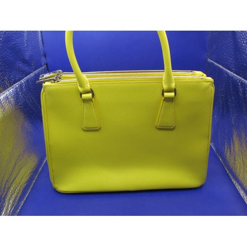 188 - A genuine PRADA small zip tote bag, material ‘Saffiano Lux Leather’, in colour ‘Sole 1’, 1BA863. In ... 