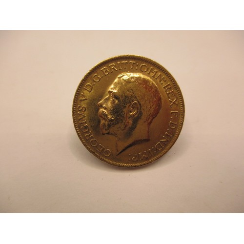 131 - A George V full gold sovereign dated 1912, a BV grade coin with good definition of features