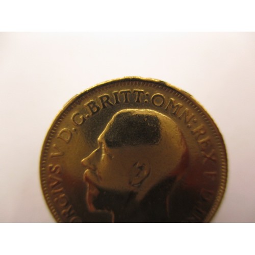 133 - A George V full gold sovereign dated 1912, a BV grade coin with good definition of features