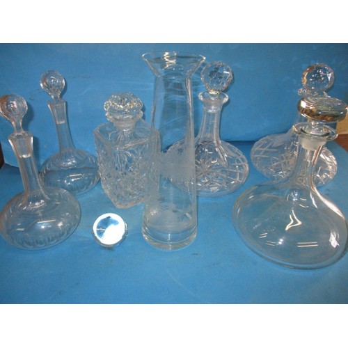 297 - A quantity of lead crystal and other drinks decanters, all in used condition, one carafe having a sm... 