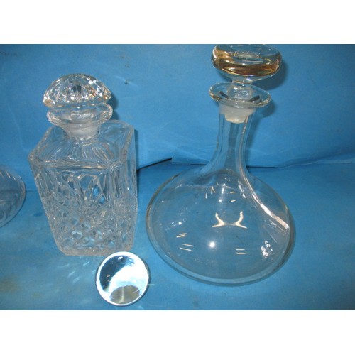 297 - A quantity of lead crystal and other drinks decanters, all in used condition, one carafe having a sm... 